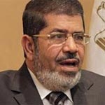 محاكمة الرئيس المعزول محمد مرسي علانية بتهم, تشمل التحريض على العنف.